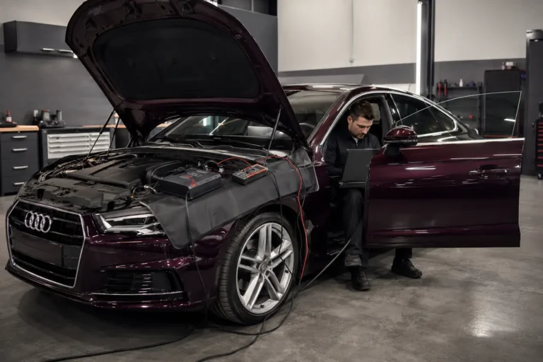 Audi electrical testing with diagnostic laptop and battery support