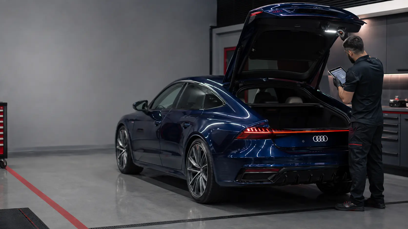 Blue Audi A7 Sportback rear hatch system being diagnosed in an independent workshop